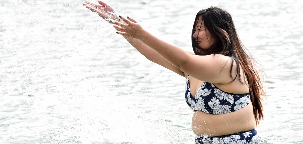 Lara Yeo (24), of Christchurch, makes the most of the beach at Doctors Point, before rain set in...