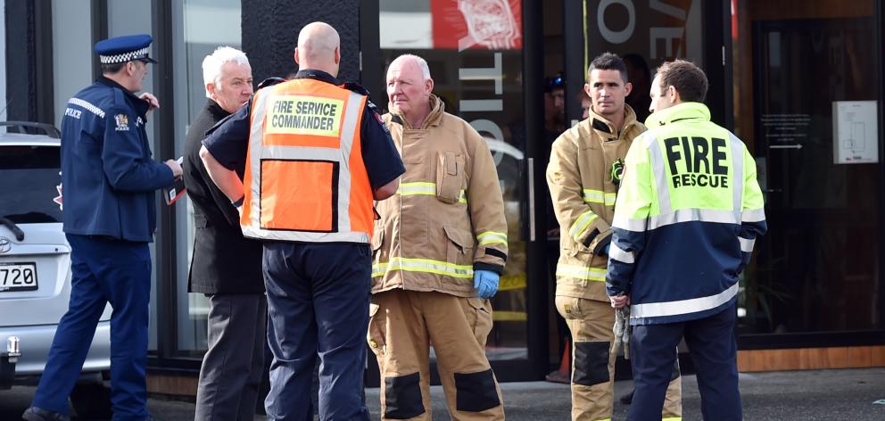 Emergency services are called to help a man on fire on King Edward St, South Dunedin, yesterday....