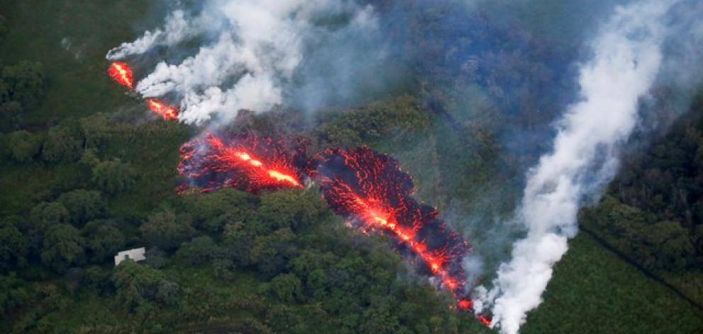 Lava erupts from a fissure east of the Leilani Estates subdivision during ongoing eruptions of the Kilauea Volcano. Photo: Reuters