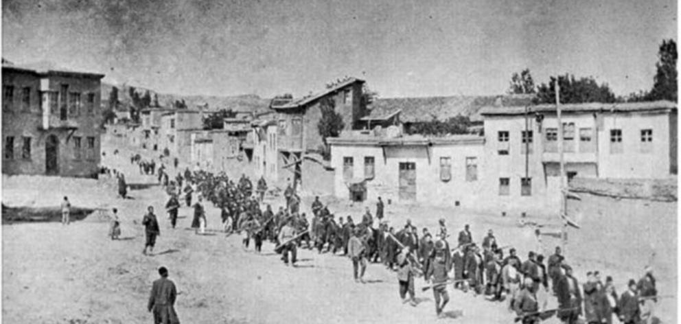 Armenian civilians are marched by armed soldiers to an Ottoman Empire prison in April 1915. PHOTO...