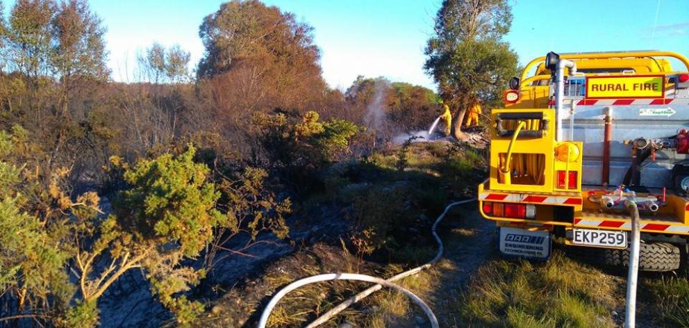 Waitaki rural firefighters control a blaze on a Waitaki River island in January 2016. Fire and Emergency New Zealand owed the district council $285,145 because of the disestablishment of the Otago Rural Fire Authority, but the council decided yesterday to