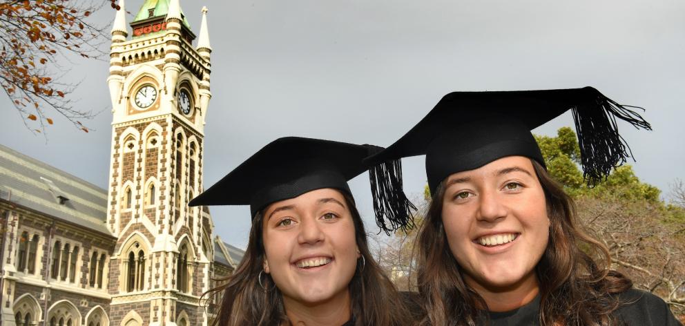 Identical twins Renee (left) and Stephanie Oliver (22) prepare to graduate from the University of...