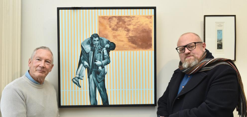 Otago Art Society incoming president Doug Hart (left) and Otago University Press marketing and publicity coordinator Victor Billot admire Humping my Bluey — a Swagman’s Tale, by Rachel Ratten, at the Otago Art Society’s ‘‘Landfall Exhibition’’. Photo: Gre