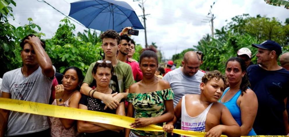 People look on near of the wreckage of a Boeing 737 plane that crashed in Cuba. Photo: Reuters