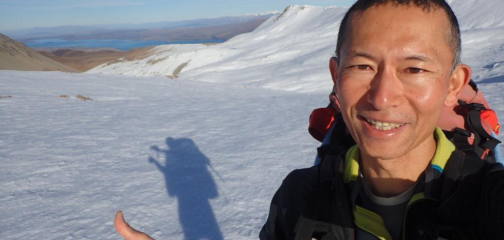 Eiji Kitai on Stag Saddle, Te Araroa’s highest point, near Lake Tekapo. Photo: Eiji Kitai