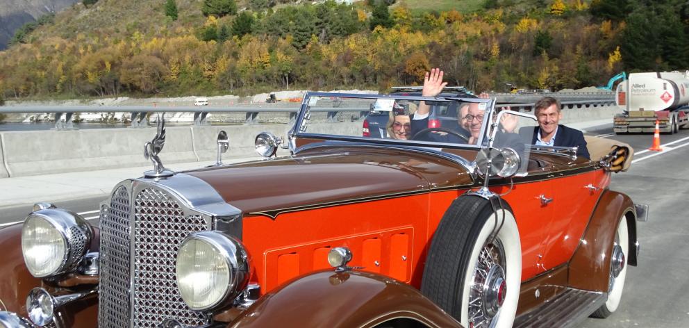 Queenstown Lakes Mayor Jim Boult drives a 1932 Packard V12 across the bridge accompanied by his...
