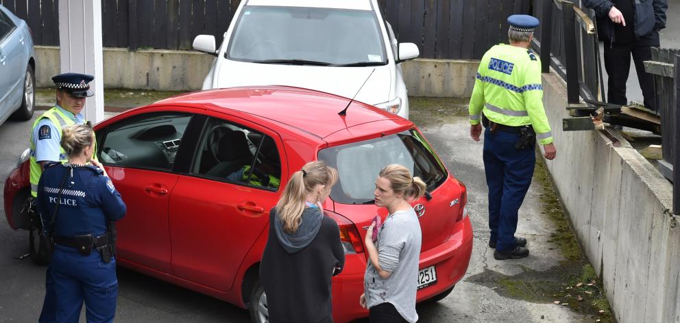 A car was driven through a fence in a car park this afternoon. Photo: Gregor Richardson