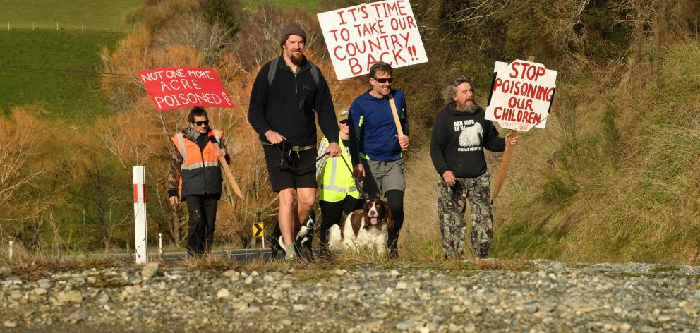 1080 protesters walk near Raes Junction on a march from Bluff to Wellington. From left: Whatu...