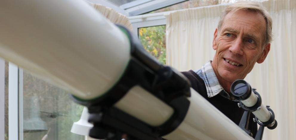 Central Otago Astronomical Society secretary and treasurer Barrie Wills with a manual telescope...