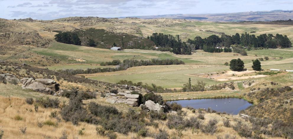 The diatomite mine at Foulden Hills (at right of picture) when it was being developed in 2012....