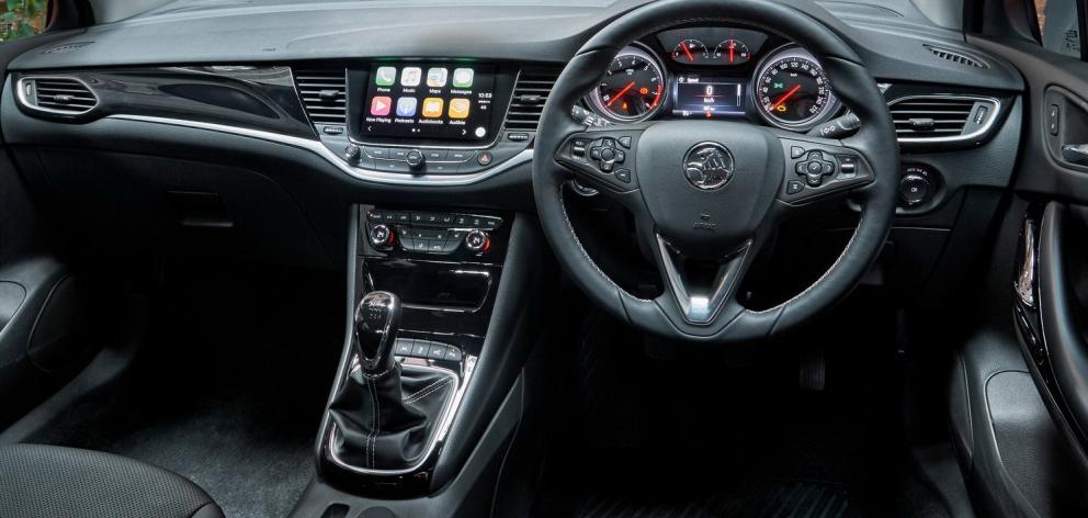 Imitation composite highlighting, snug heated sports seats, and a heated sports steering wheel...