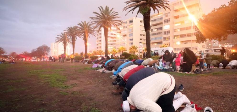 Muslims pray as they gather for the sighting of the moon in Cape Town. Photo: Reuters