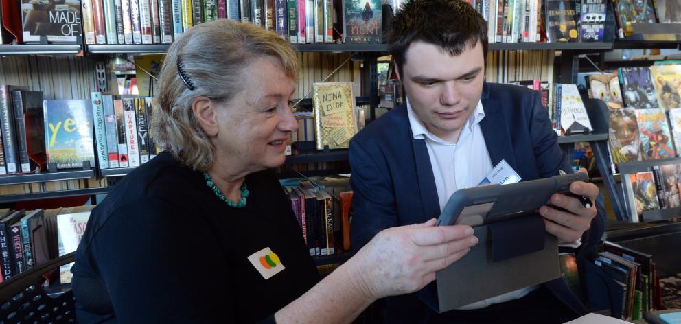 Clare Reilly, of Waitati, learns about her tablet from Otago Polytechnic information technology...