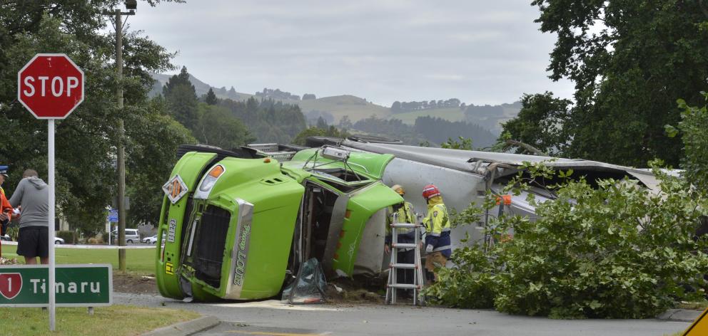 Emergency services at the scene of a Summerland Express truck crash at the intersection of Pine Hill Rd and Great King St last December. Photo: Gerard O'Brien