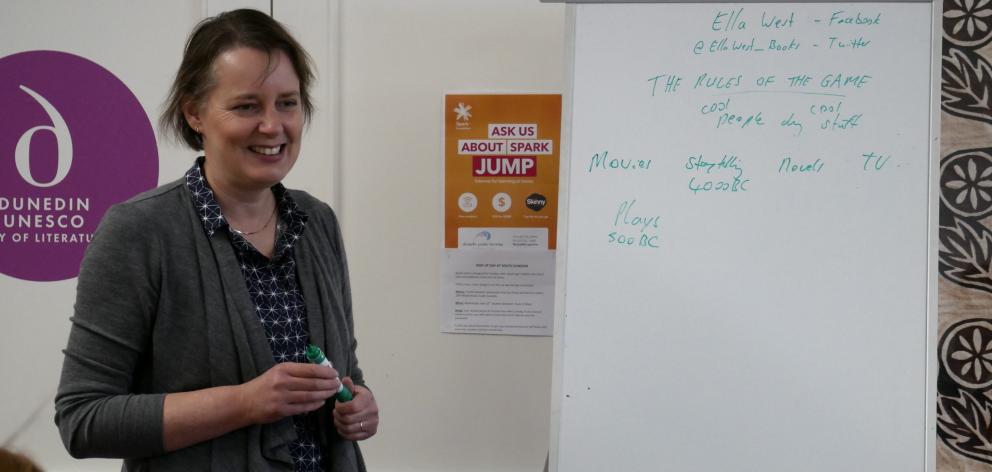 Author Ella West talks to Queen’s High School pupils during a workshop at the South Dunedin Community Pop-Up last week.  Photo: Jessica Wilson
