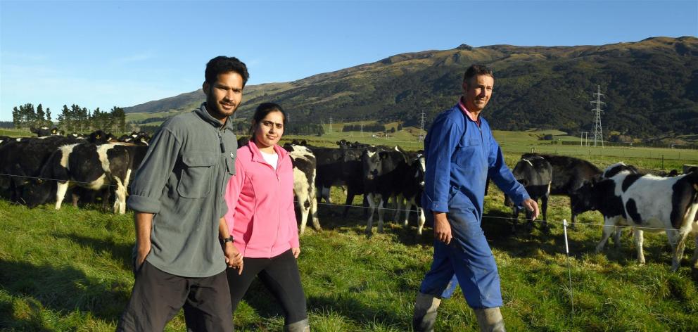 Herd manager Harrie Chander can stay in New Zealand but Immigration New Zealand wants to send his wife, Pawandeep, a nurse, back to India. Mr Chander works for Taieri farmer Mark Adam (also pictured). Photo: Stephen Jaquiery