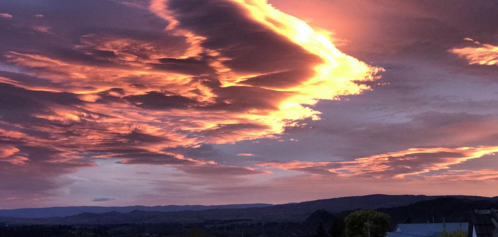 A fiery-edged lenticular cloud flying above Alexandra in March. Photo: Joy Bennett