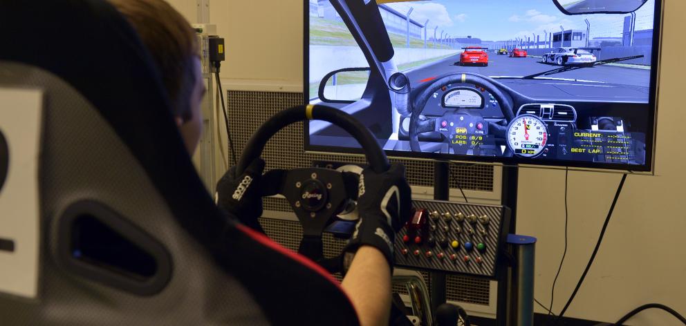 Peter Vodanovich (19) trains in the driving simulator at the School of Physical Education during...