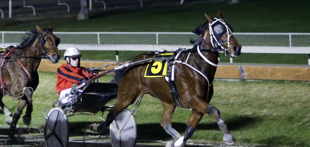 Mark Hurrell drives Redwood Invasion to win the Darren De Filippi Memorial Trot at Addington on...