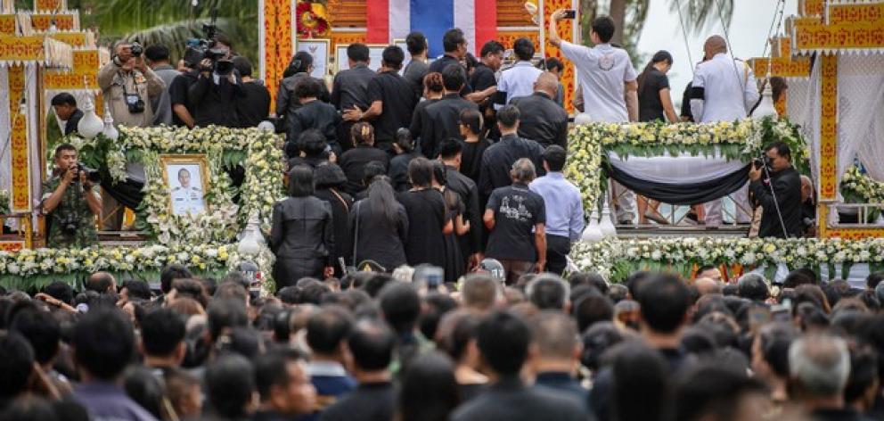 People attend a funeral of Samarn Kunan. Photo: Reuters