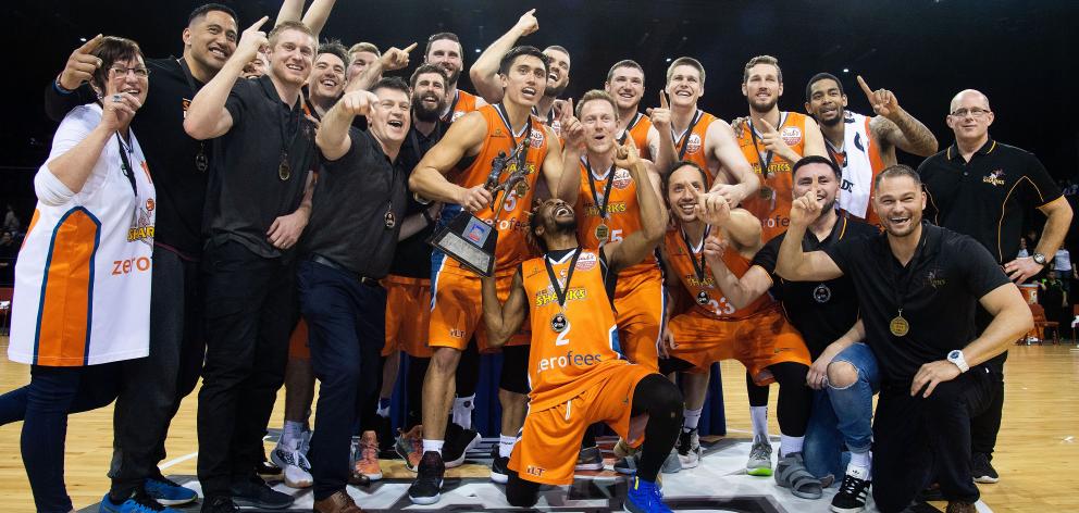 The Southland Sharks celebrate after beating the Wellington Saints in the NBL final in Wellington...