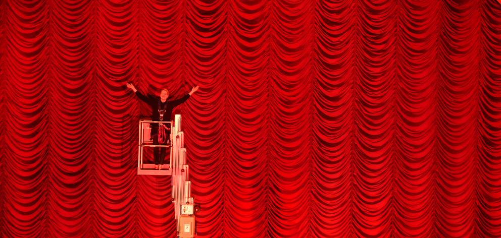 Regent Theatre director Sarah Anderson celebrates the installation of the theatre’s new waterfall curtain. Photo: Stephen Jaquiery