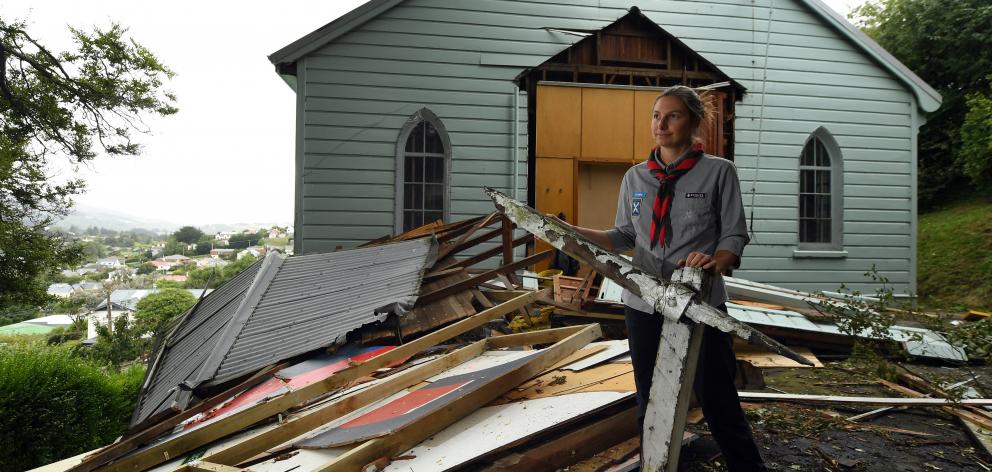 Roslyn Scouts group leader Kim Cousins surveys the damage to the Roslyn scout hall in February...