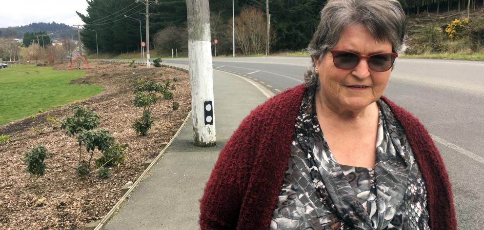 Pam Harris, of Sunnyvale, believes the position of a power pole on a footpath in Main South Rd poses a danger to pedestrians.  Photo: Shawn McAvinue
