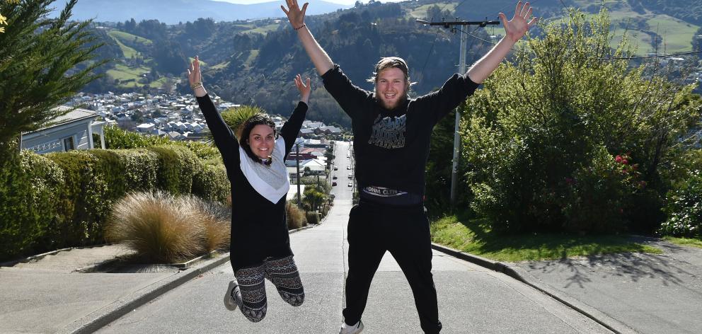 Backpackers Sabrina Zanin,  of Italy, and Malte Sturmann,  of Germany,  celebrate getting to the...
