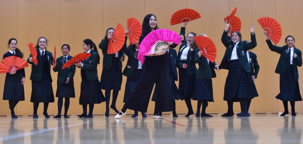 Chinese folk dance teacher Yujia Song, of Christchurch, teaches year 9 Columba College pupils a traditional Chinese dance using fans, as part of New Zealand Chinese Language Week. Photo: Peter McIntosh