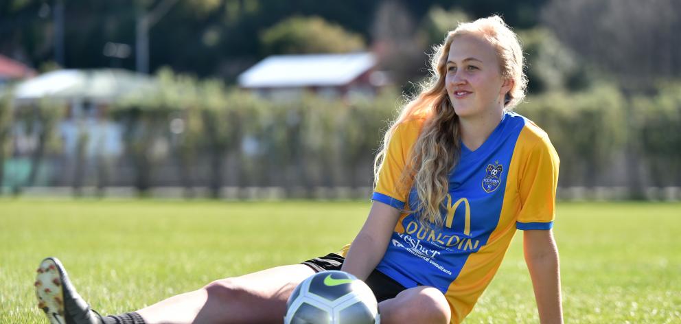 Southern United player Emily Morison (19) enjoys the sun at Logan Park yesterday as she prepares...