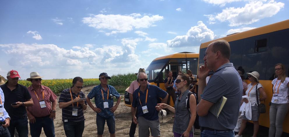 Eric Watson (front centre, in shorts and dark blue top) listens during a farm visit between Odessa and Kiev in Ukraine. Photo: Supplied