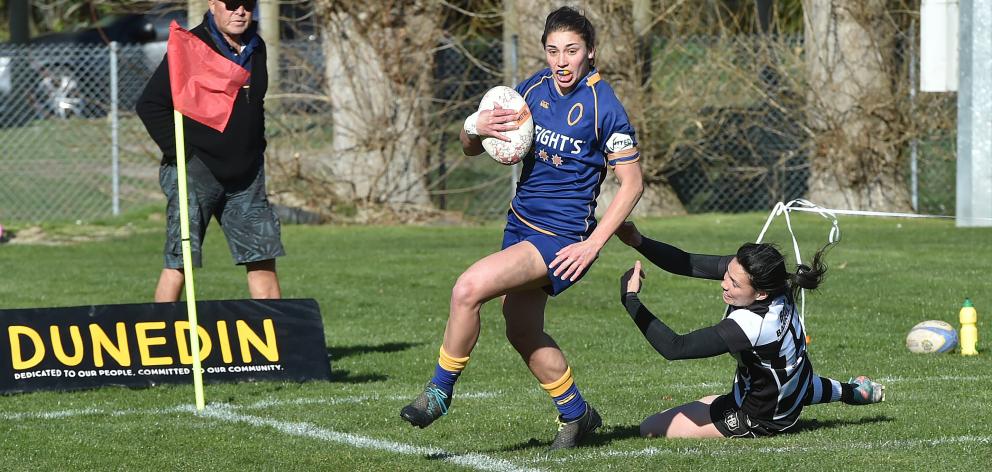 Otago Spirit fullback Sheree Hume is about to score, brushing aside the tackle of her opposite,...
