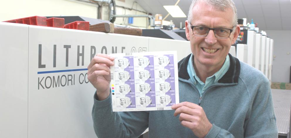 Southern Colour Print managing director Sean McMahon with some of the 84,000 new women’s suffrage 125th anniversary stamps, which were printed at the Dunedin facility. Photo: John Lewis