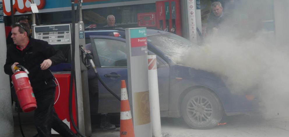 The engine of a car caught fire on the forecourt of the Balclutha Caltex this afternoon. Photo: Richard Davison