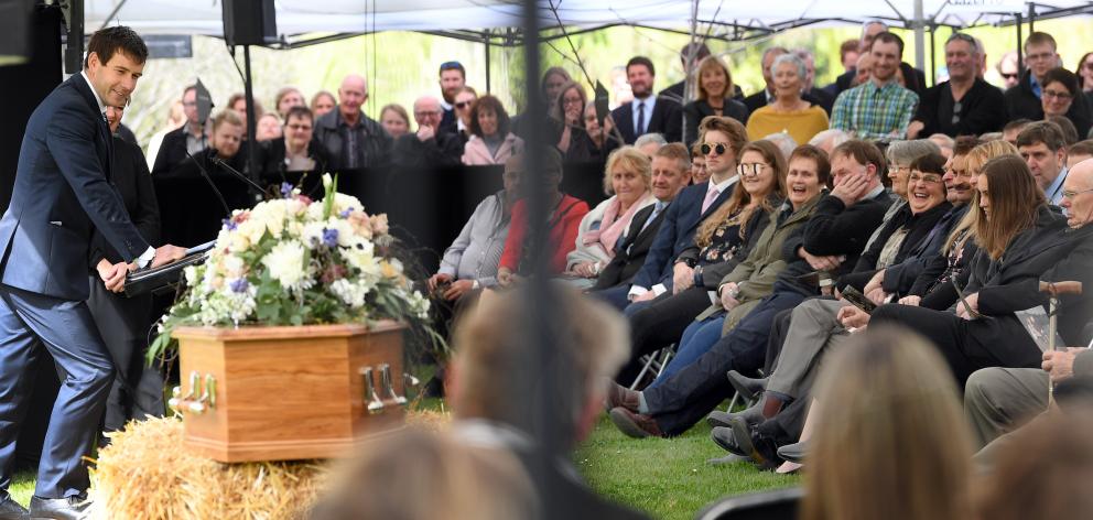 Scott Tomlinson speaks at the funeral of his wife, Nadine, and son, Angus (3), at Flaxes Retreat...