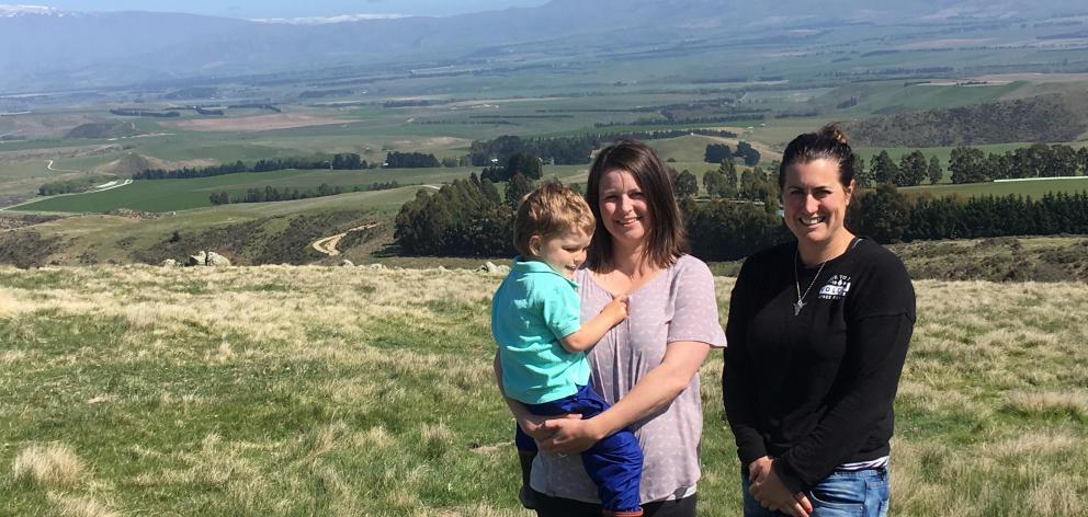 Hakataramea Sustainability Collective members Sarah Elliot holding Gus (3), and Juliet Gray, who farm in the Hakataramea Valley. Photo: Sally Rae