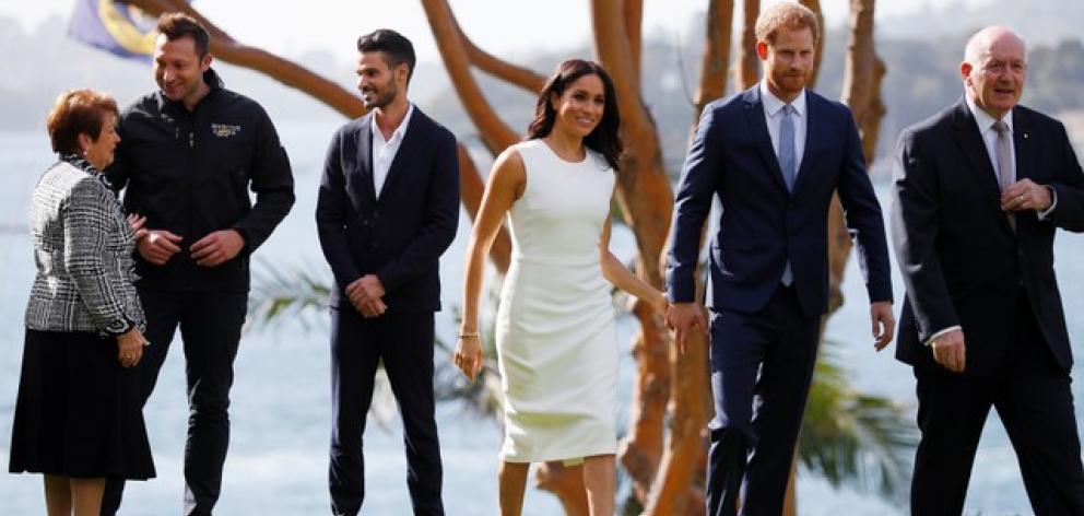 Britain's Prince Harry and wife Meghan, Duchess of Sussex walk with Australia's Governor General Peter Cosgrove and his wife Lynne Cosgrove at Admiralty House. Photo: Reuters