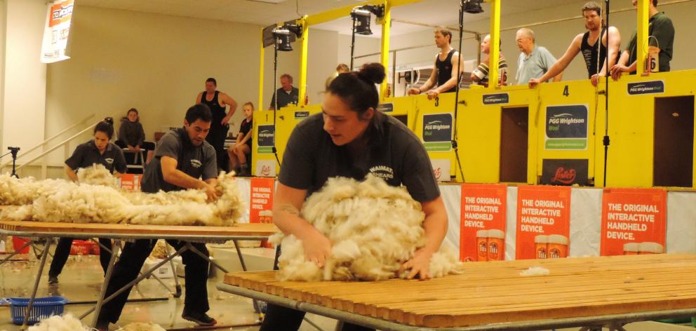 Reigning national woolhandling champion Joel Henare (at centre table) from Gisborne/Motueka made...