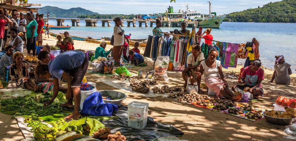 Market day on Marapa Island brings regional families together to buy, sell and visit. 