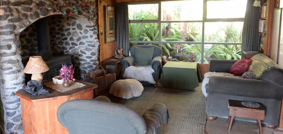 The rustic fireplace in the living area was built by Ms Diettrich and features stone from the...
