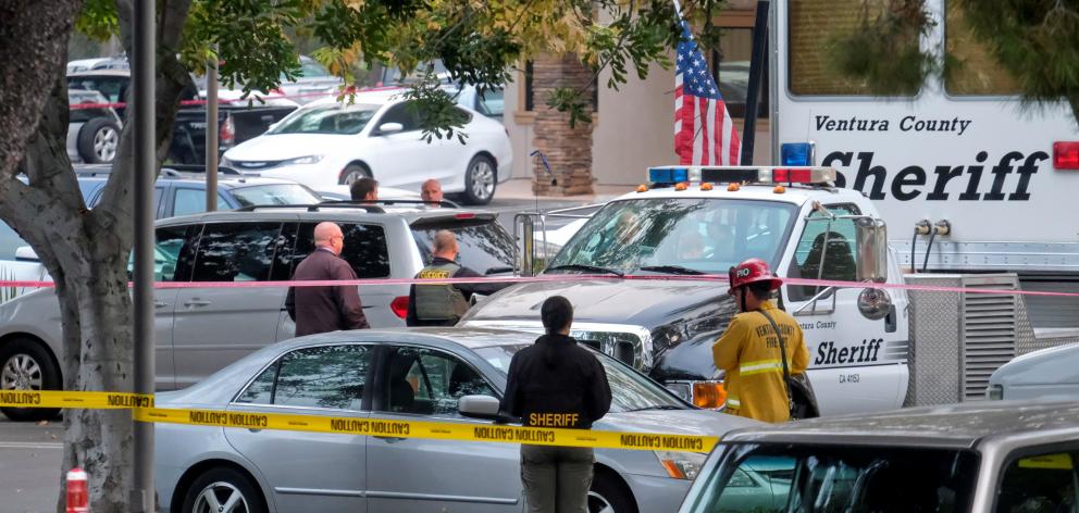 Police guard the site of a mass shooting at a bar in Thousand Oaks. Photo: Reuters