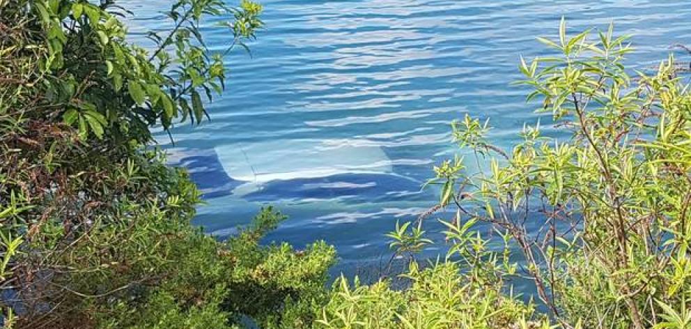 A car is submerged in Tikitapu (Blue Lake). Photo: Ben Fraser