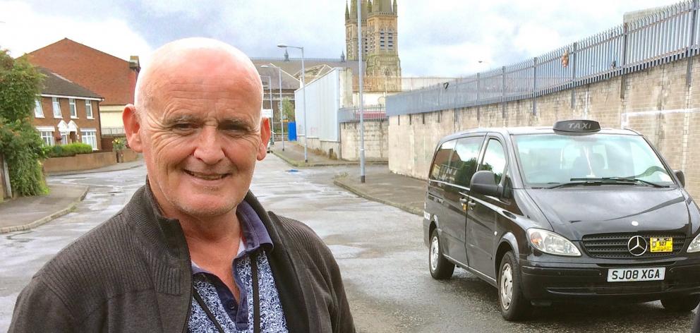 Black Taxi Tours driver Jim O’Neill near Falls Rd, Belfast.

