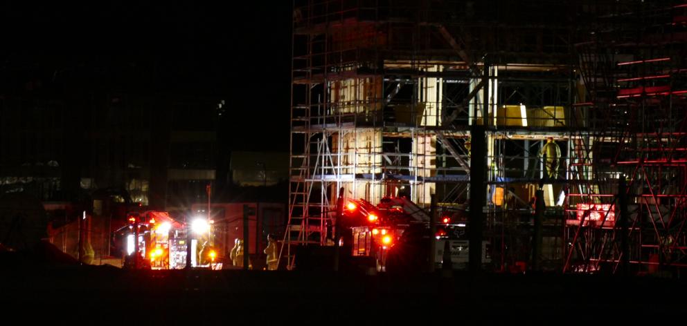 Firefighters respond to a fire at a construction site on Hawthorne Drive, in Frankton, last night. Photo: Josh Walton