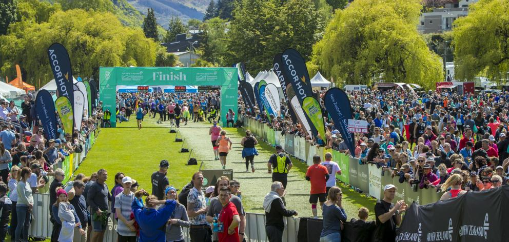 Supporters cheer on the runners in the Air New Zealand Queenstown International Marathon at the...
