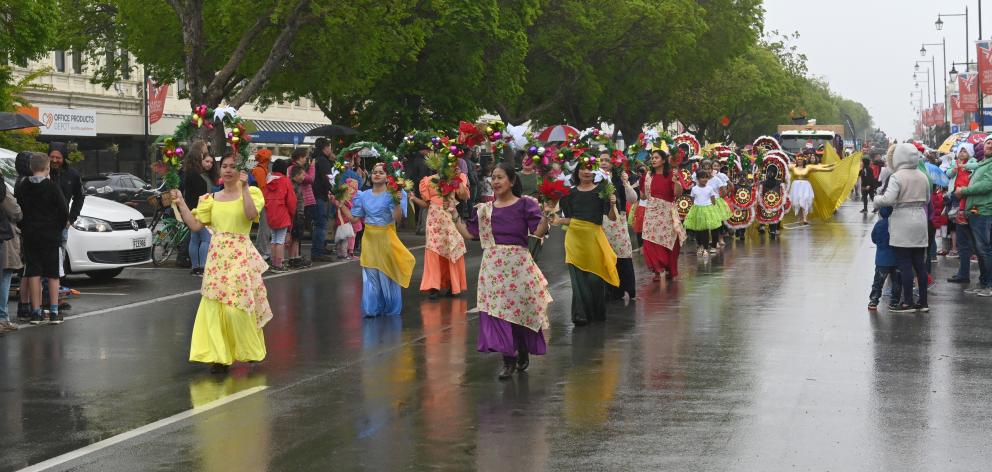 The Filipino Waitaki Inc entry at the Waitaki District Santa Parade makes its way down Thames St...