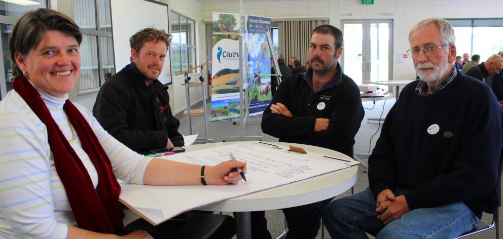 Otago Regional Councillor Carmen Hope (left) talks with farmers (second from left) Ash Townsend, Richard Steel and Denis Greer, from the Lake Tuakitoto catchment group about what the issues and solutions were in their area. Photo: Ella Stokes