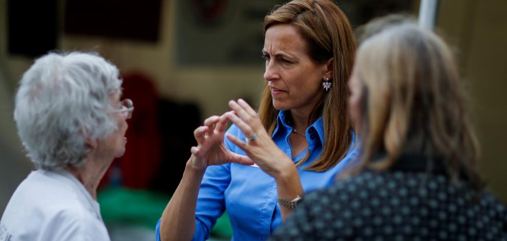 US Democratic congressional candidate Sherrill speaks with people as she campaigns during the New Jersey State Fair. Photo: Reuters