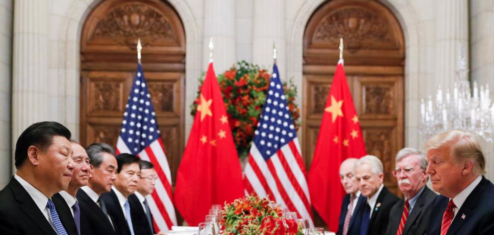 Chinese President Xi Jinping (left) and US President Donald Trump (right) at dinner after the G20...